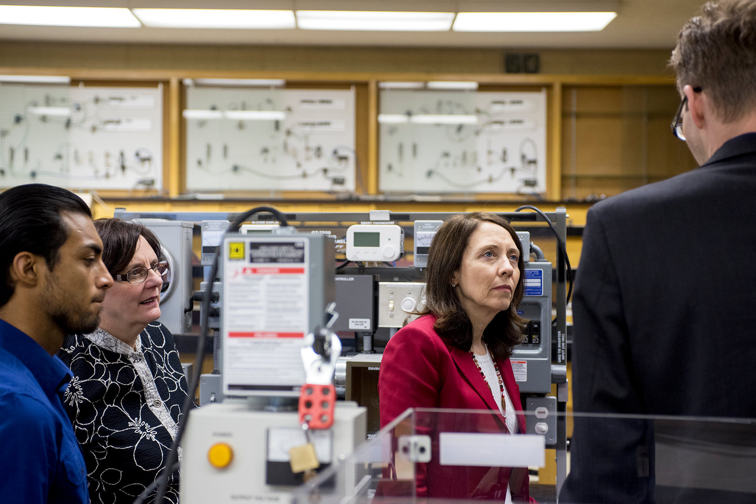 U.S. Sen. Maria Cantwell, D-Washington, listens as former Centralia College student, John Hofman, right, gives a tour of an electrical engineering classroom in Kemp Hall at Centralia College on Wednesday afternoon.
