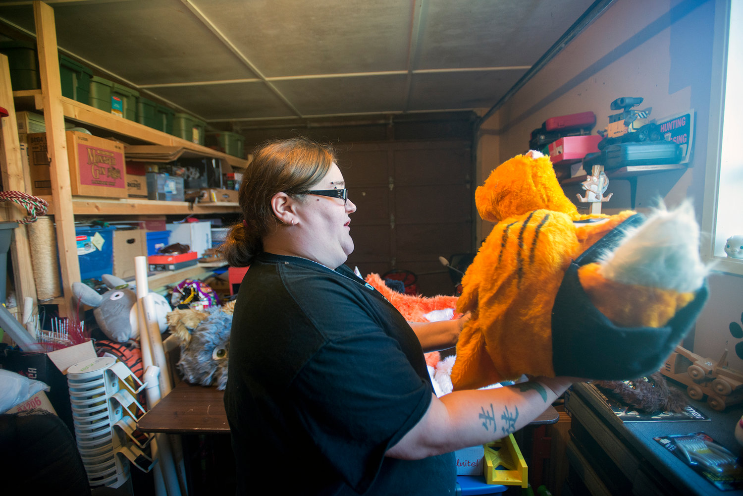 Amanda Grary holds up a costume head that she designed and built from scratch at her home in Centralia on Tuesday, Nov. 11.