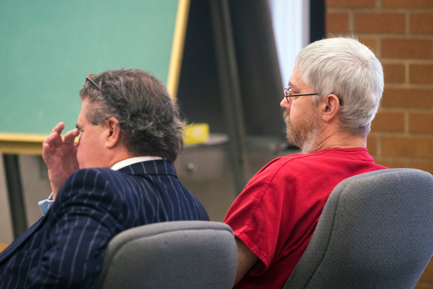 Defense attorney John Crowley, center, and Rick Riffe, react after public statements were made during Riffe's sentencing hearing in Lewis County Superior Court on Monday afternoon at the Lewis County Law and Justice Center in Chehalis.