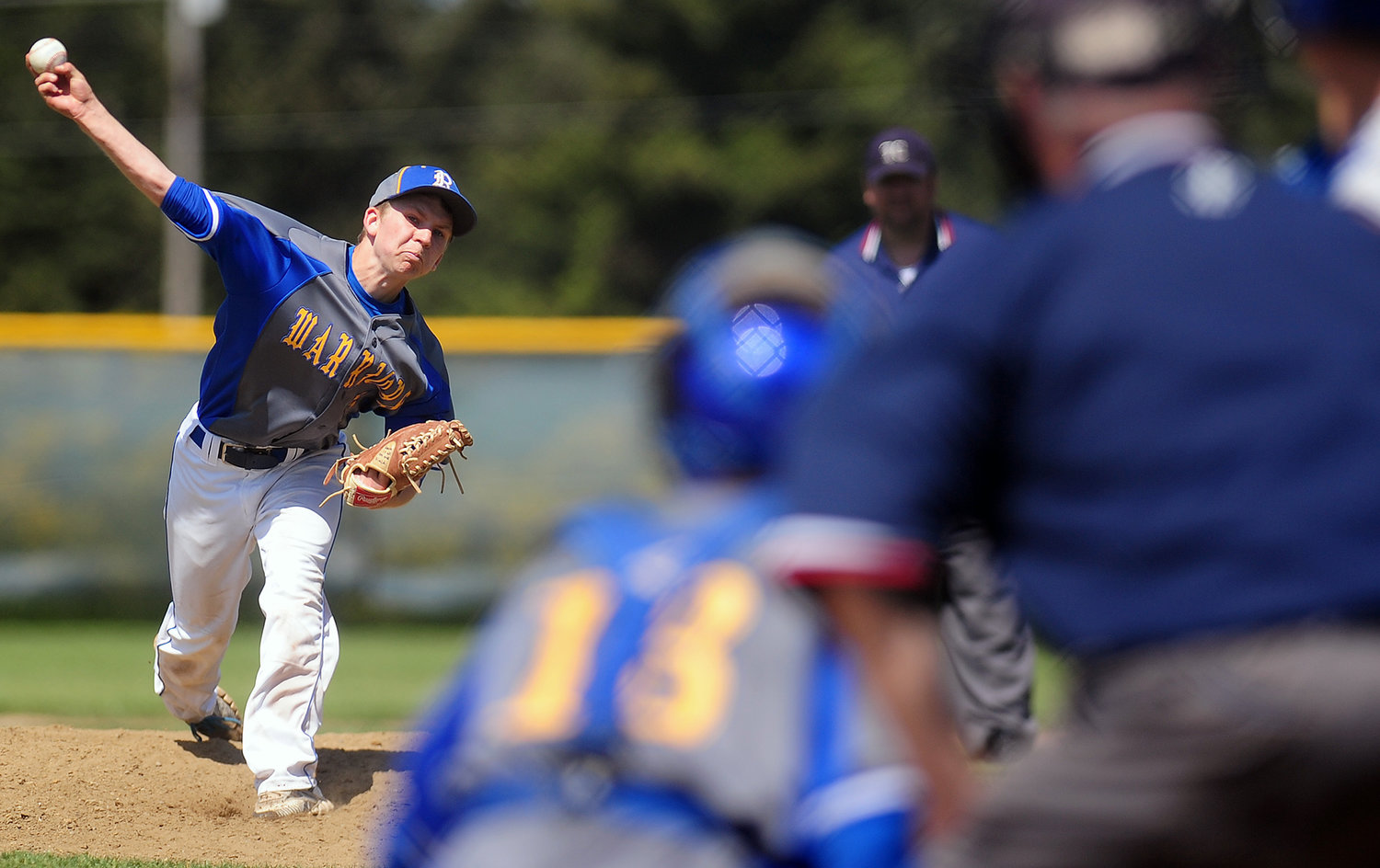 In this photo taken, Tuesday, May 13, Rochester High School senior Dylan Fosnacht delivers a pitch to a La Center batter during the 13th inning of a District IV 1A Baseball Tournament first-round game at Rochester High School in Rochester, Wash. Fosnacht threw 194 pitches in 14 innings of work and was pulled by head coach Jerry Striegel after the first two La Center batters reached base in the top of the 15th inning. "We talked to him every inning, and he said he felt comfortable, he felt good, and he's a little competitor," Striegel said. "He didn't want to come out of the ballgame. He wasn't very pleased when I took him out in the 15th." Rochester won the game 1-0 on a squeeze bunt in the bottom of the 17th inning.