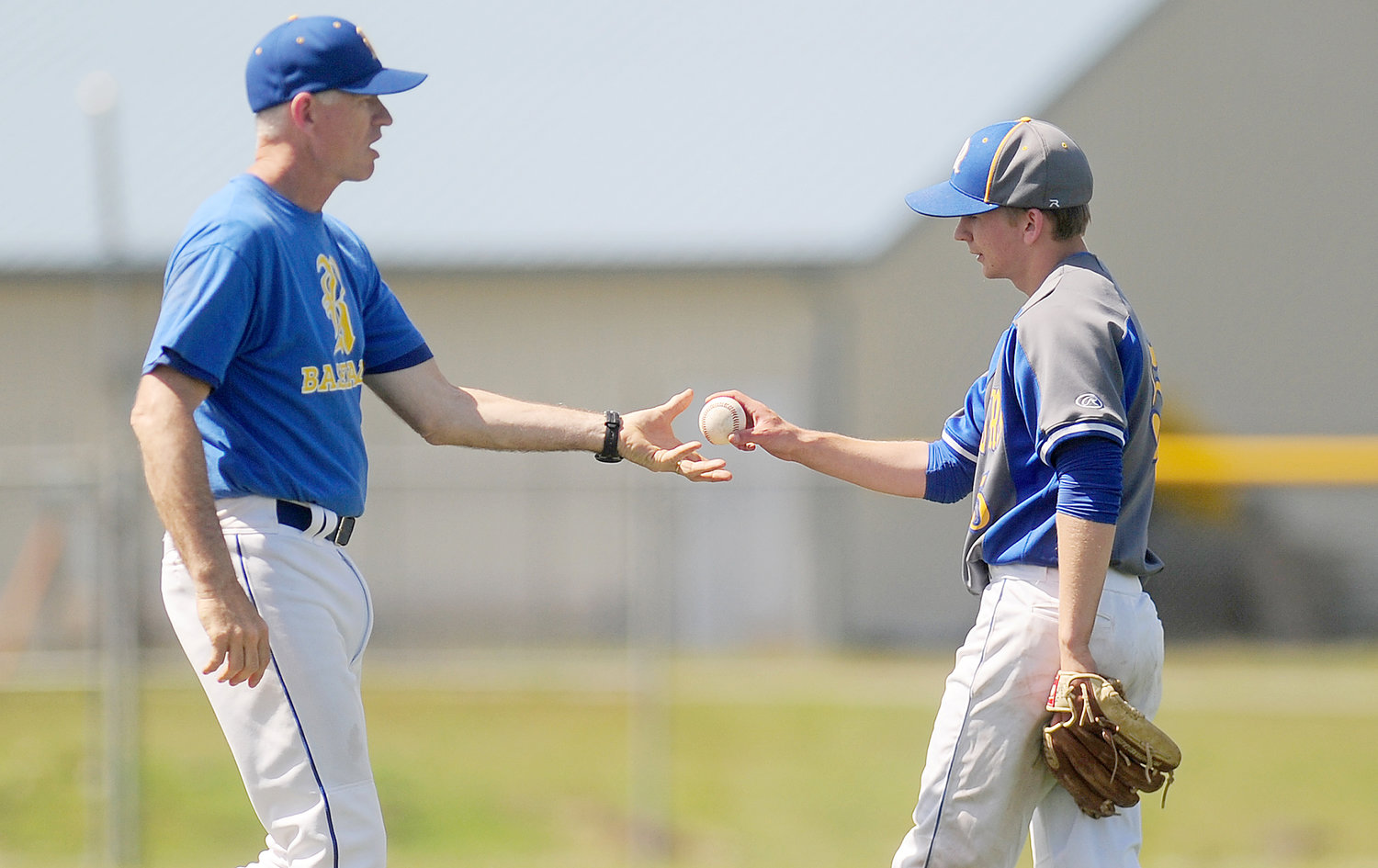 In this photo taken on Tuesday, May 13, Rochester High School head baseball coach Jerry Striegel removes starting pitcher Dylan Fosnacht from the mound after Fosnacht pitched a shutout into the 15th inning of a District IV 1A Baseball Tournament first-round game against La Center on Tuesday in Rochester, Wash. “There is kind of an uncomfortable feeling when you send a kid out for the 13-14-15th (innings),” Rochester coach Jerry Striegel said. “His velocity looked like it hadn’t changed very much, and he said he felt good.”