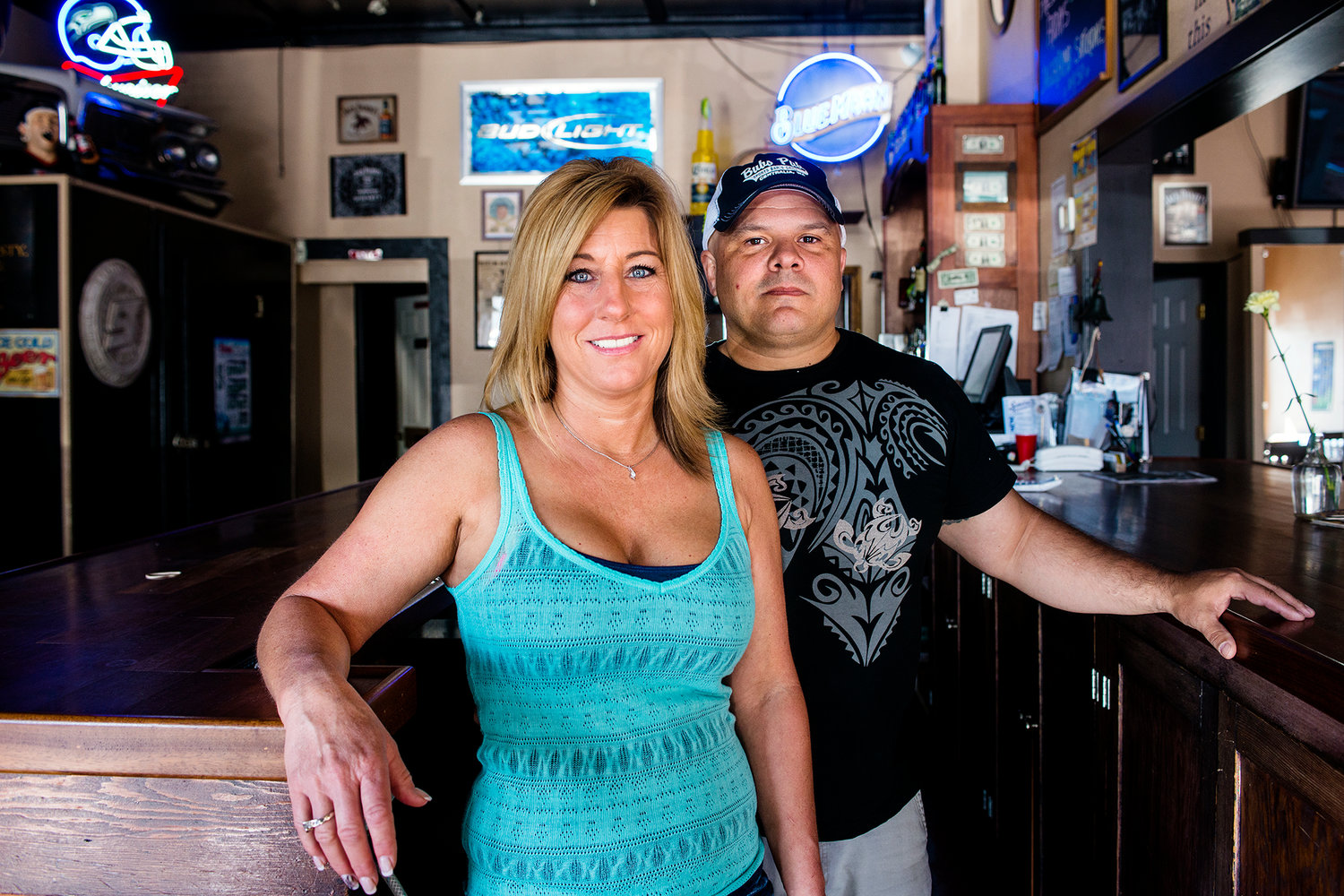 Brandon and Marianne Viggers pose for a portrait behind the bar at Sidelines Pub in Chehalis on Wednesday morning.