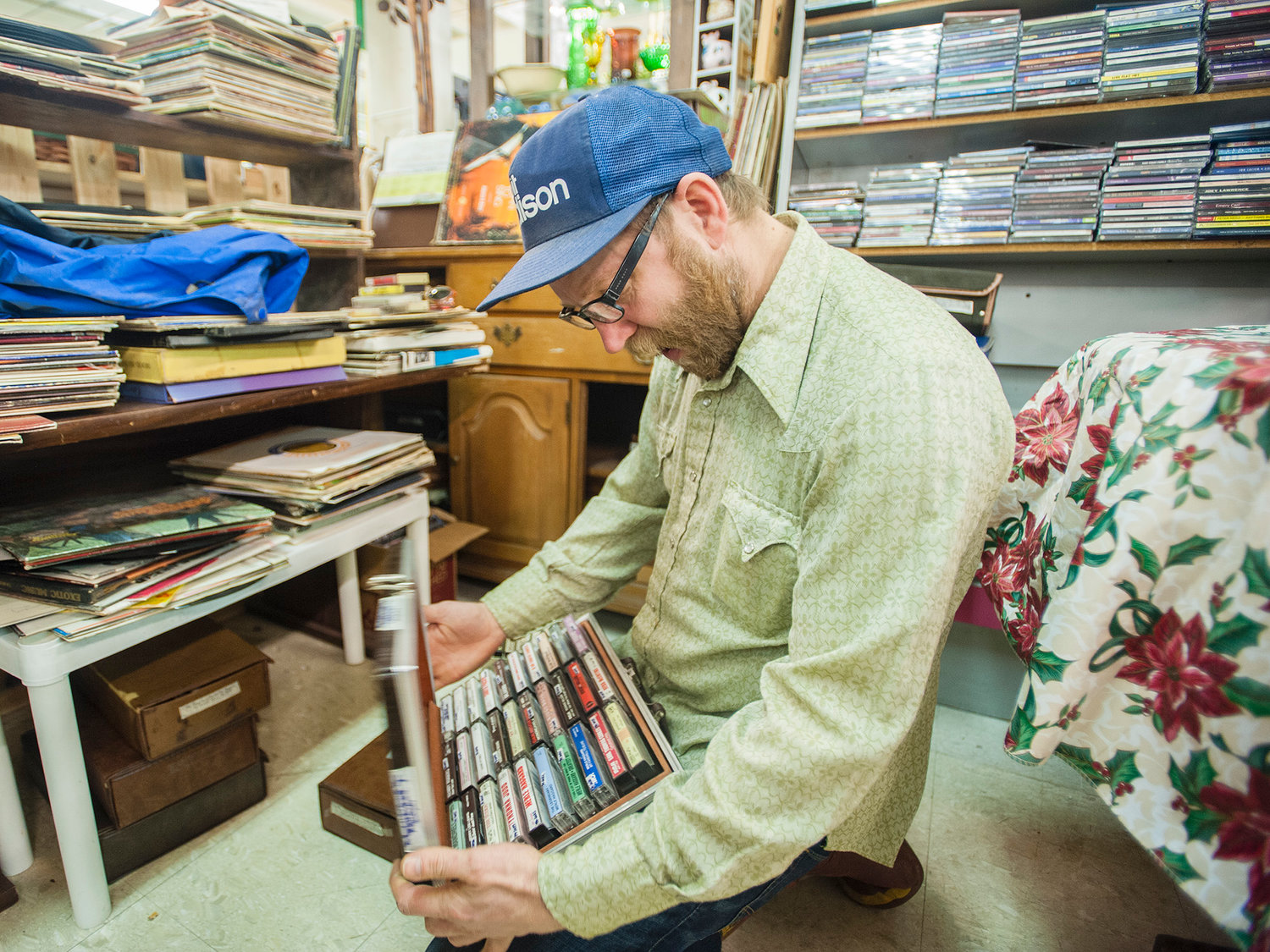 Mat Griesse, Chehalis, looks through cassette tapes at Cowlitz River Antiques at Yard Birds Mall in Chehalis on Monday, March 3, 2014.