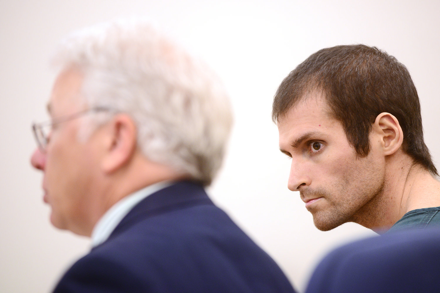 Ryon T. Connery, right, looks over at his defense attorney, David Arcuri during a sentencing hearing in Lewis County Superior Court on Wednesday afternoon at the Lewis County Law and Justice Center in Chehalis. Connery was sentenced to 16 months on two counts of third-degree assault of a child.