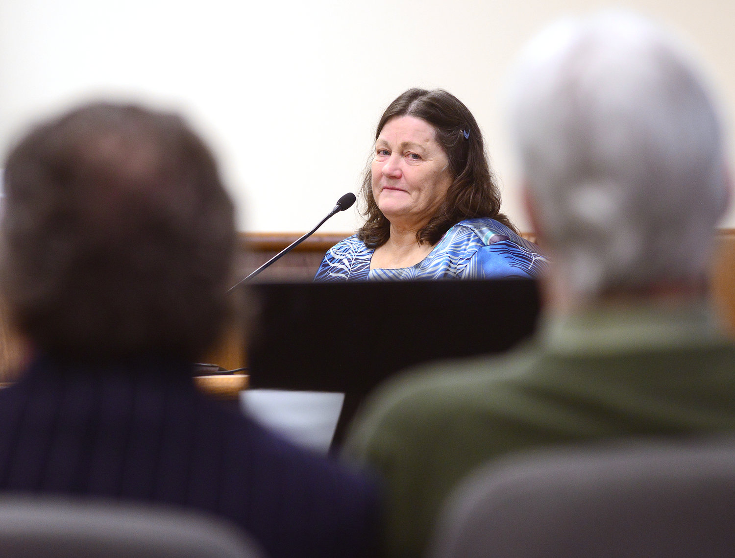 Deborah George looks over at Rick Riffe, right, and his defense attorney, John Crowley, during his testimony in Riffe's double-homicide trial in Lewis County Superior Court on Thursday afternoon at the Lewis County Law and Justice Center in Chehalis.