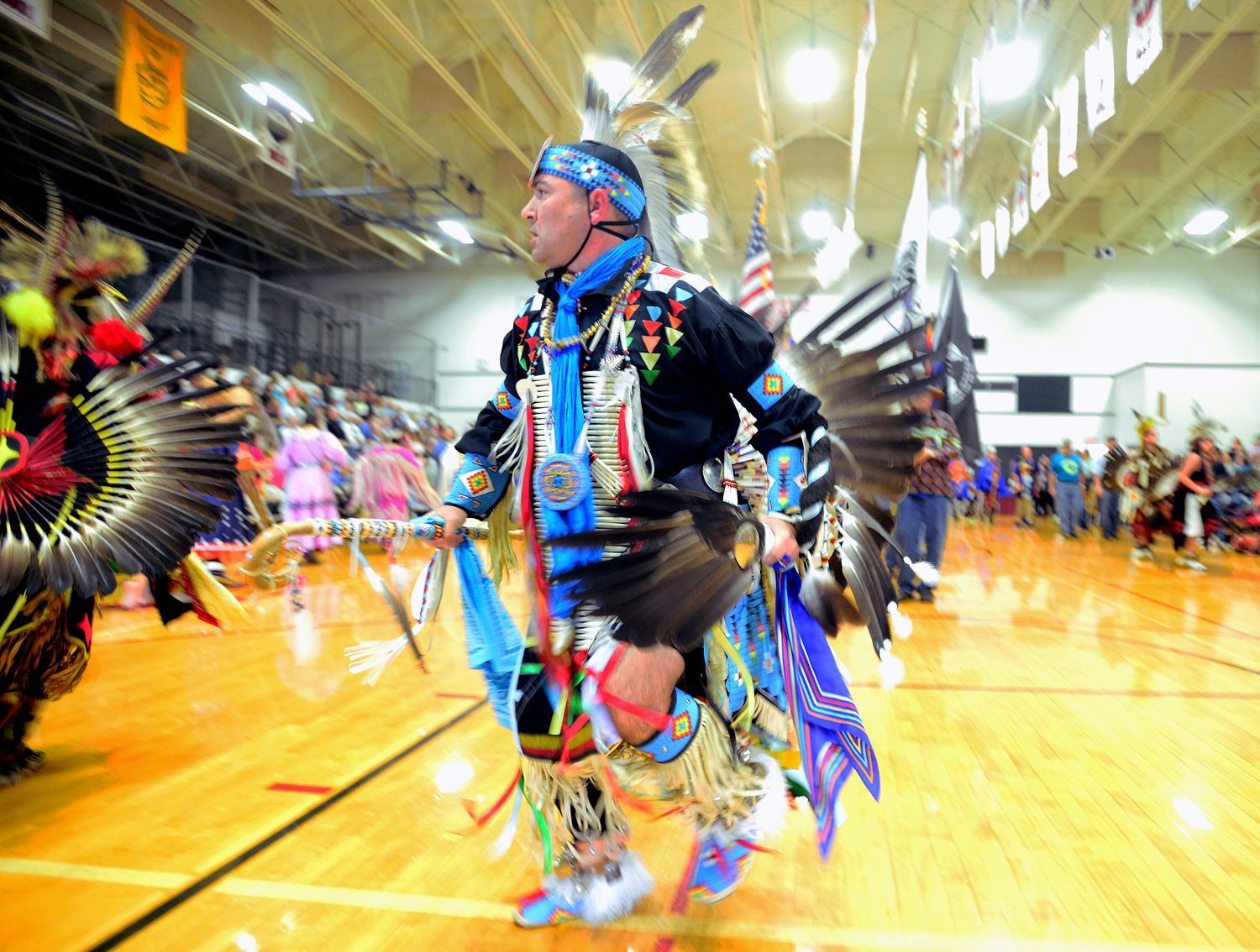 Nathan Hooton, Sedalia, Mo., dances during the opening ceremonies of the Cowlitz Indian Tribe's 14th Annual Pow-Wow on Saturday afternoon at Toledo High School.
