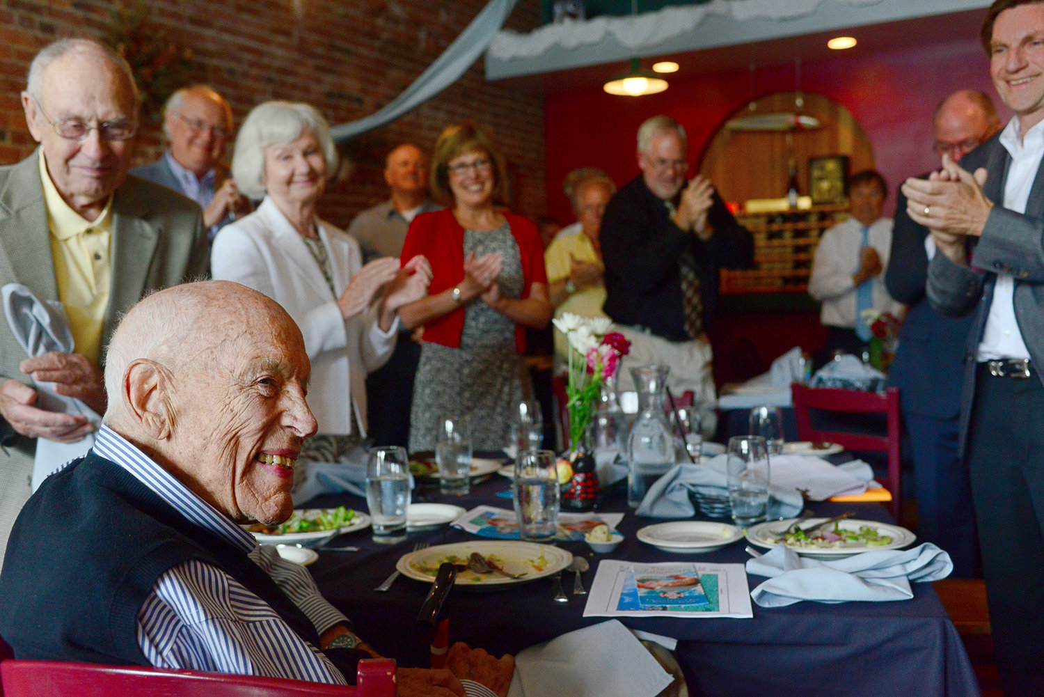 Gail Shaw receives a standing ovation from the crowd at the Chehalis Foundation luncheon on Friday afternoon at Mackinaw's in Chehalis. On Friday it was announced that the new Chehalis aquatic center at Recreation Park will be named after Shaw, and his wife, Carolyn.