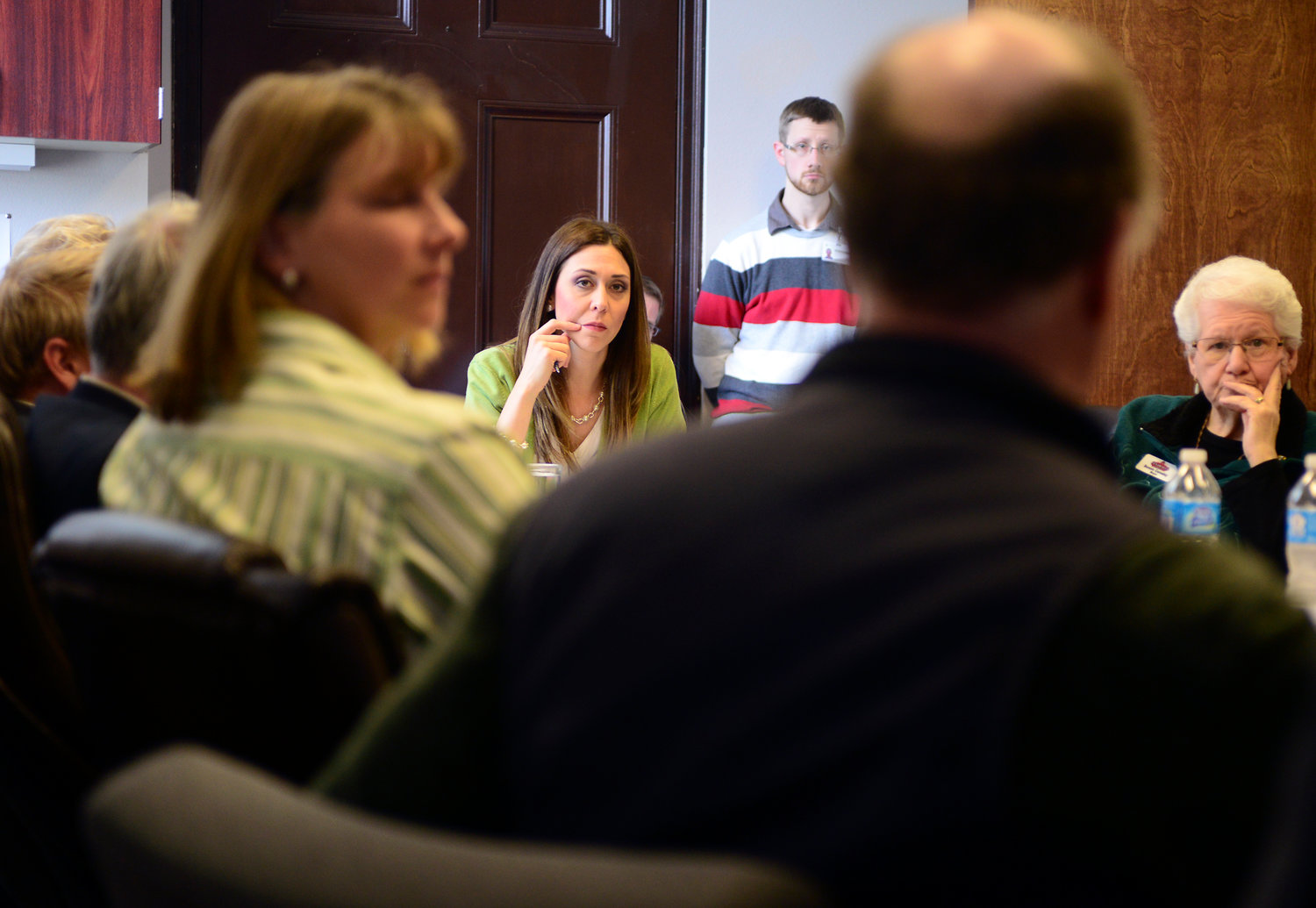 Jaime Herrera Beutler, R-Camas, center, listens as forest management experts and volunteers talk about forest roads in the Gifford Pinchot National Forest on Wednesday afternoon during a community roundtable at the Lewis County Commissioners conference room at the Old Courthouse in Chehalis.