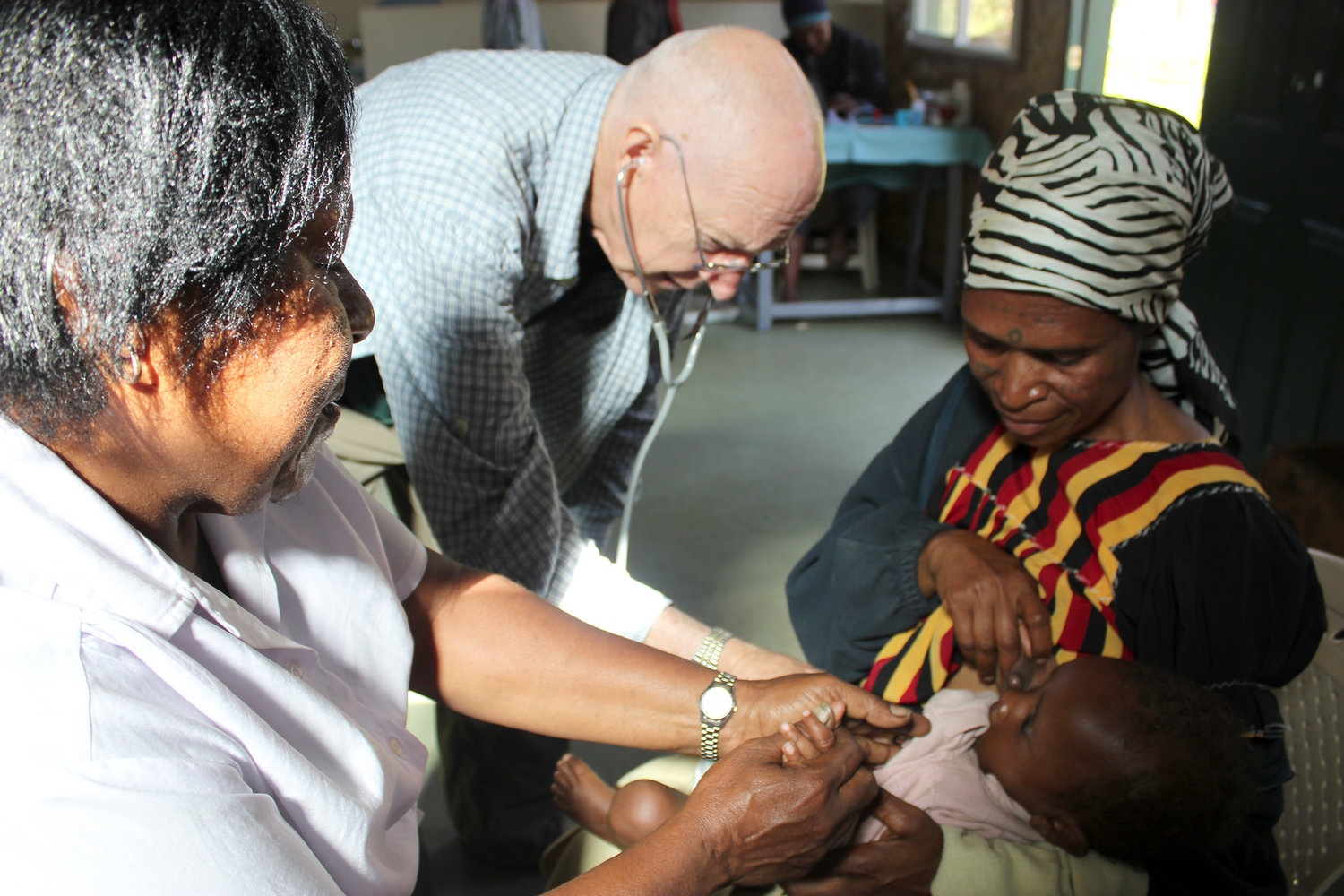 Dr. Larry Hull examines a child with a heart murmur at the medical clinic at the Madan coffee plantation in September 2011 in Papua New Guinea. Hull and his wife, Aarlie own the non-profit plantation and have built a birthing center and medical center for the community. According to Mrs. Hull, the birthing center is primarily used to identify high-risk pregnancies so they can be sent to the missionary hospital nearly 30 kilometers away.