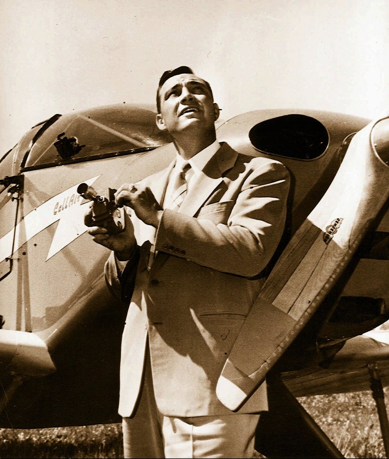 Kenneth Arnold, seen in a 1947 file photo, holds a movie camera in front of his Callair, shortly after his sighting of nine alleged UFOs near Mount Rainier, Wash.  "He vowed that if he saw any more of these things he'd get it on camera,"  Kim Arnold said of her father. In honor of the 50th anniversary of the sighting, Kim is writing a book, "June 24, 1947: Kenneth Arnold and the Birth of UFOs." (AP Photo/Idaho Statesman)