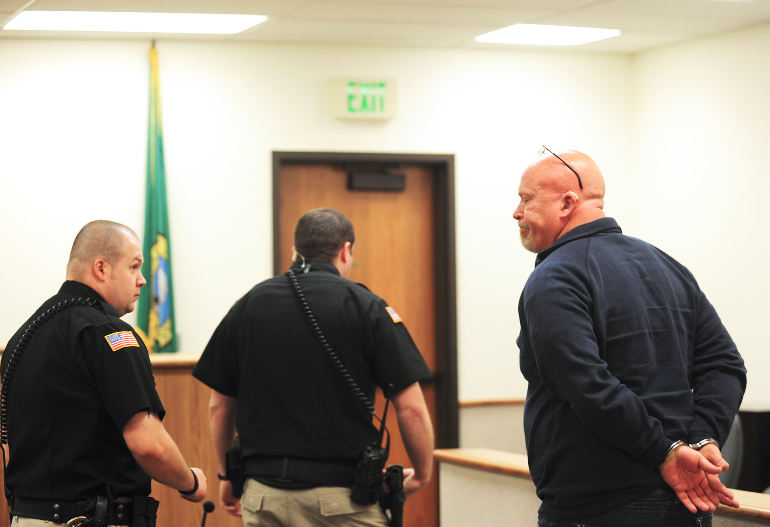 After being handcuffed, Kenneth Sands, of Rainier, walks out of the courtroom after being sentenced to five months in jail on Tuesday in Superior Court at the Lewis County Law and Justice Center in Chehalis.