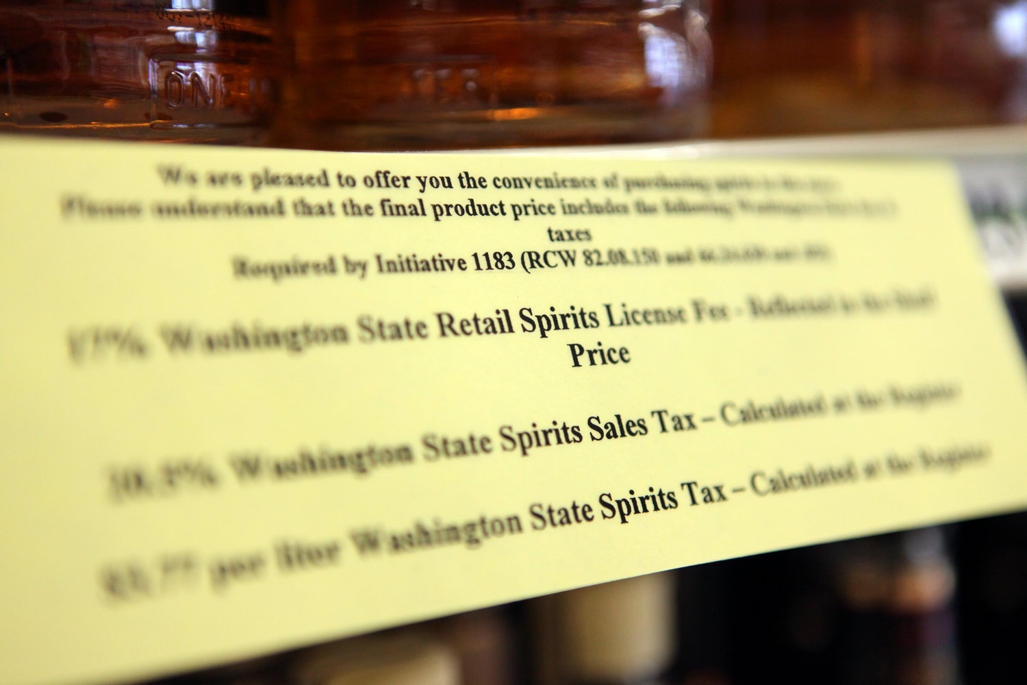 A sign notifies customers of extra fees brought on by state taxes at the Shop-N-Kart market in Centralia