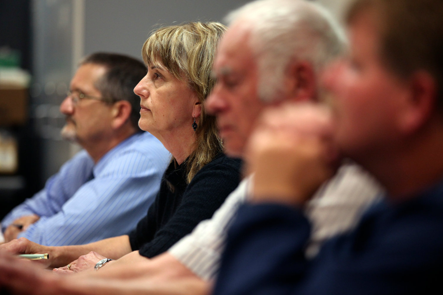 Members of the Onalaska School Board listen to comments from a standing-room crowd about the elementary school's sex education policy during a meeting Monday evening.
