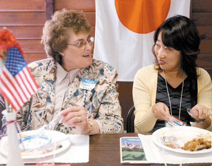 Donna Karvia of Chehalis talks with Yakuri Matsumoto, a tour guide from Inasa, Japan, in this photo taken at the Virgil R. Lee Community Building at Recreation Park in 2004. 