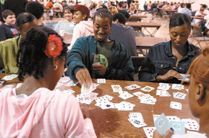 Heather Trimm / The Chronicle Green Hill School prisoner Jelani Archie, 20, plays Pounce Sunday with his family, clockwise from his right: Mahogany Timmons, cousin; T'Yanna Timmons, cousin; Giavonni White, sister; and Darline Archie, mother.