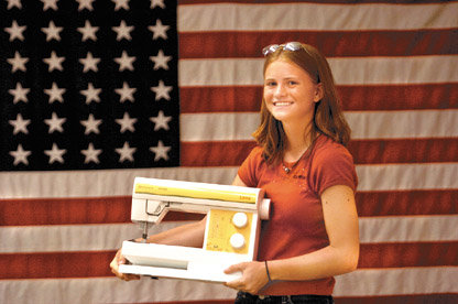 Alex Sutherland / The Chronicle Onalaskan Annie Rosenberg, 15, was rewarded with a new sewing machine from Billie's Designer Fabrics on Saturday for winning the Intermediate-Senior 4-H Clothing Expo sewing contest at the Southwest Washington Fair.