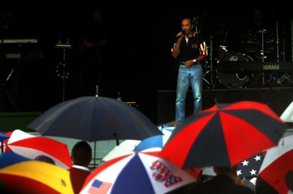 Alex Sutherland / The Chronicle A crowd shelters itself from the elements on Saturday while listening to the first of two concerts performed by country music singer Lee Greenwood at the Southwest Washington Fair.