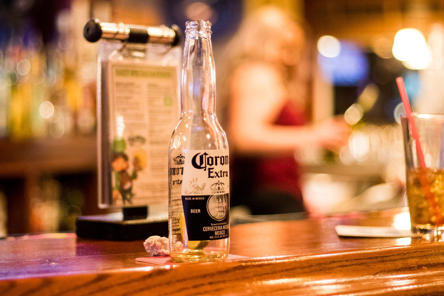 An empty beer bottle sits on the countertop at O'Blarney's Irish Pub in mid-March 2020 before such establishments were forced to close for months. 