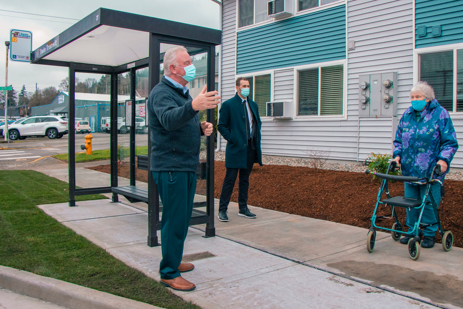 Joe Clark, executive director of Twin Transit, far left, introduces Jean Fairgrieve, far right, to a newly installed bus stop along South Market Blvd. in Chehalis dedicated to her in January.