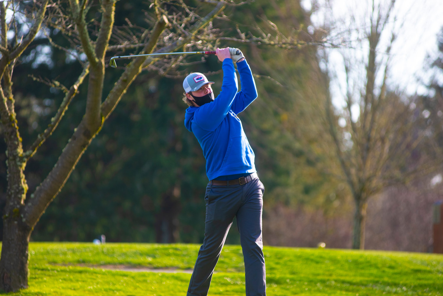 Rochester's Johnny Childers swings in a match against Tumwater on Wednesday.
