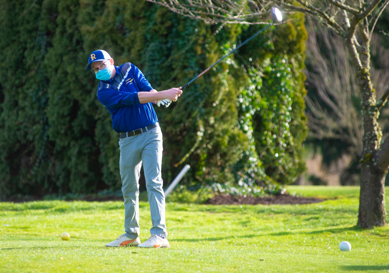 Rochester's Luke Barth tees off against Tumwater at Riverside Golf Course Wednesday.