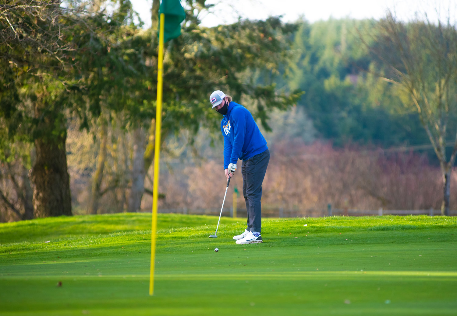 Rochester's Johnny Childers putts during a match against Tumwater at Riverside Golf Course Wednesday.