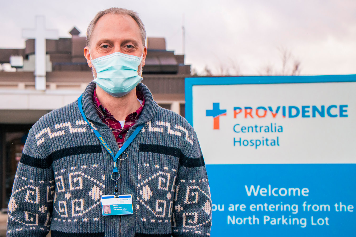 Kevin Caserta poses for a photo in front of Providence Centralia Hospital earlier this year.