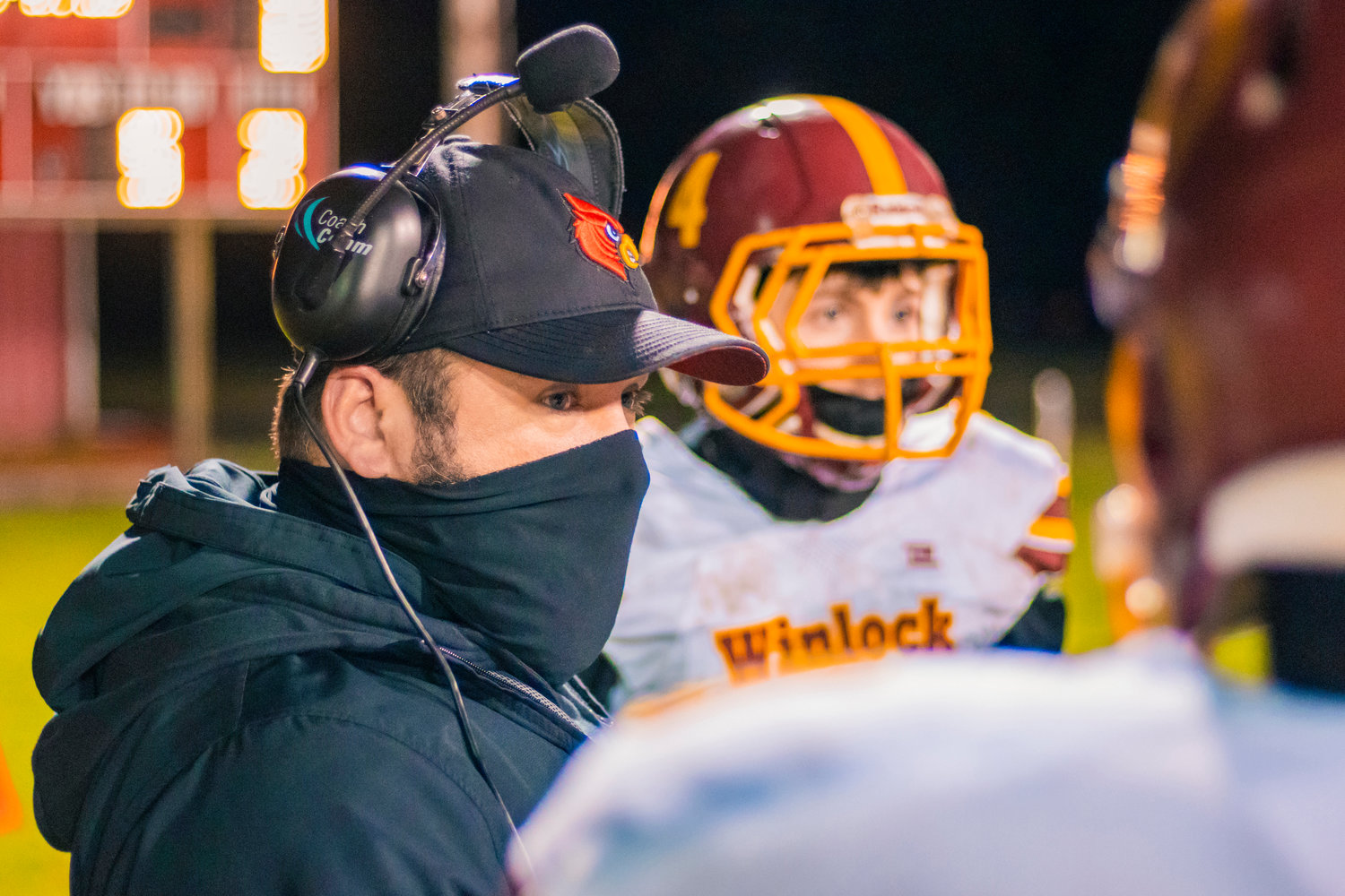 Cardinals’ Head Coach talks to players during a game against the Vikings Friday night in Mossyrock.
