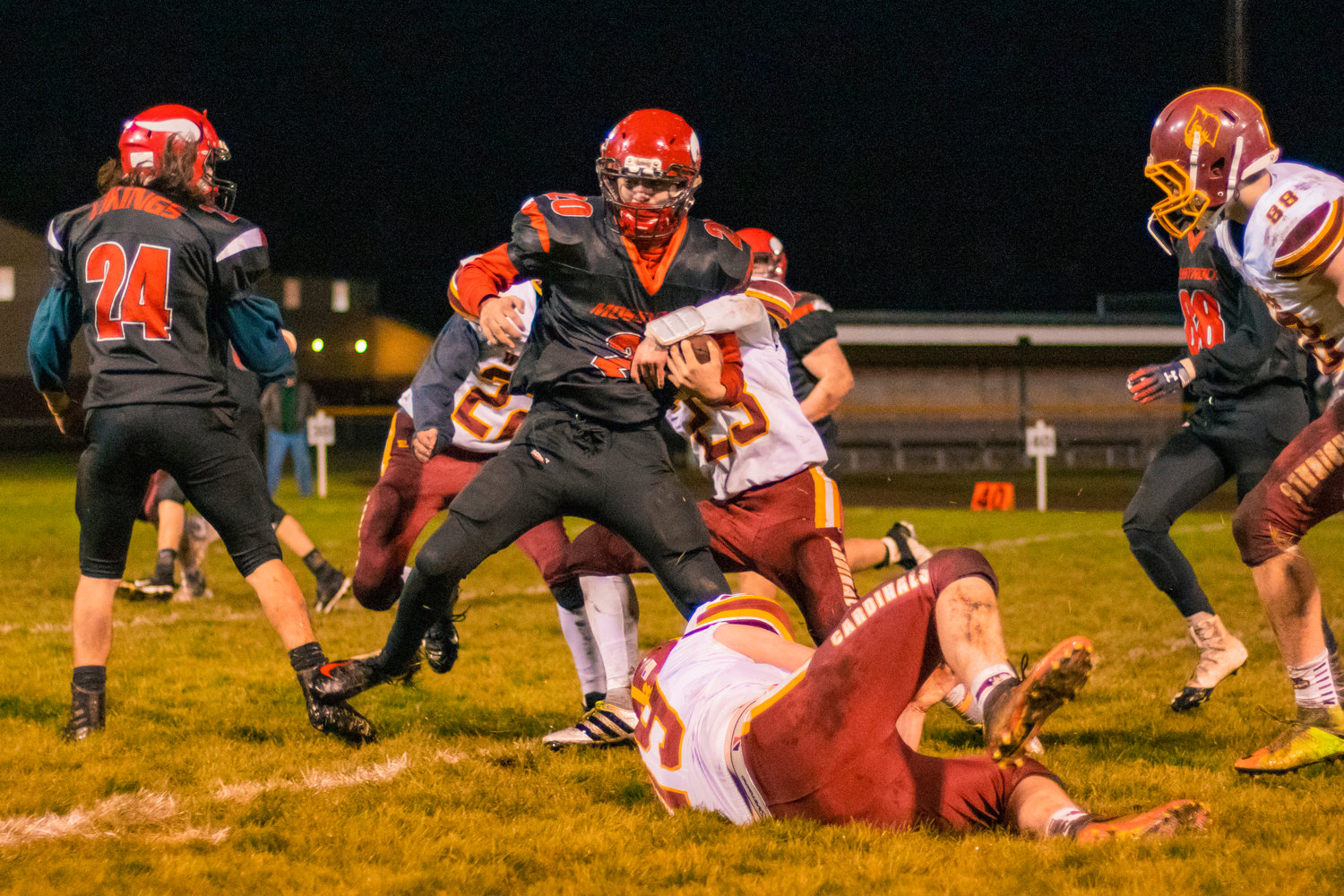 Vikings’ Matteo Mendoza (20) fights for extra yardage during a game against the Cardinals Friday night in Mossyrock.