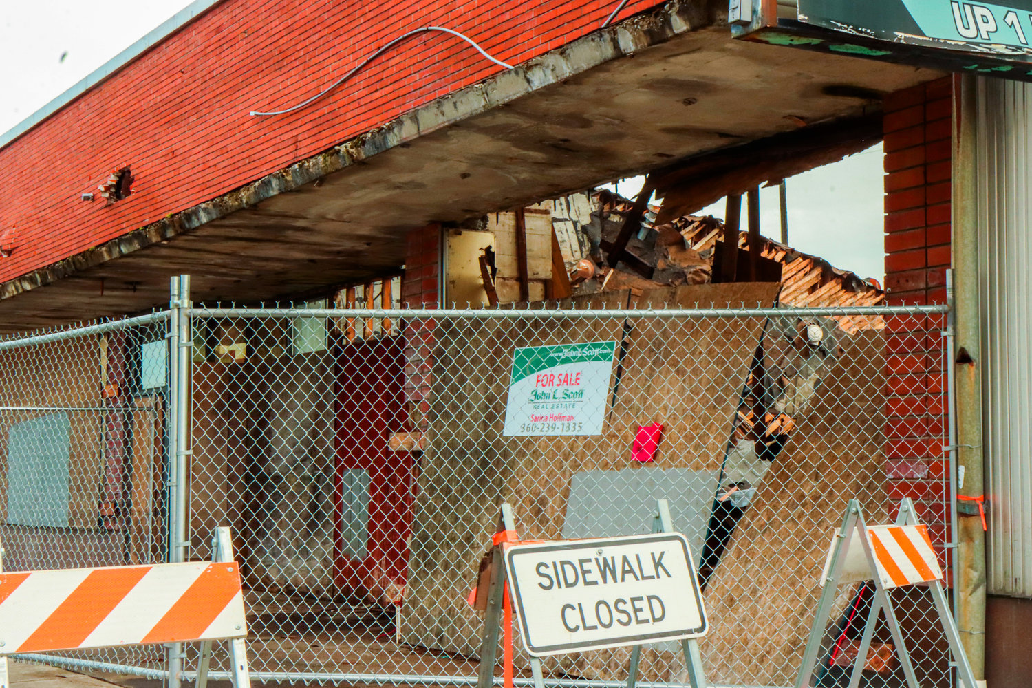 The sidewalk remains closed along North Tower Avenue in Centralia in front of a building where the roof collapsed.
