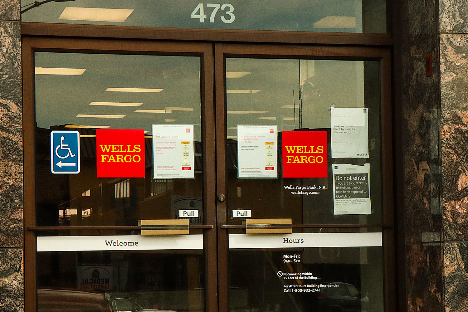 Signs on the Wells Fargo located at 473 North Market Boulevard indicate the branch is closing.