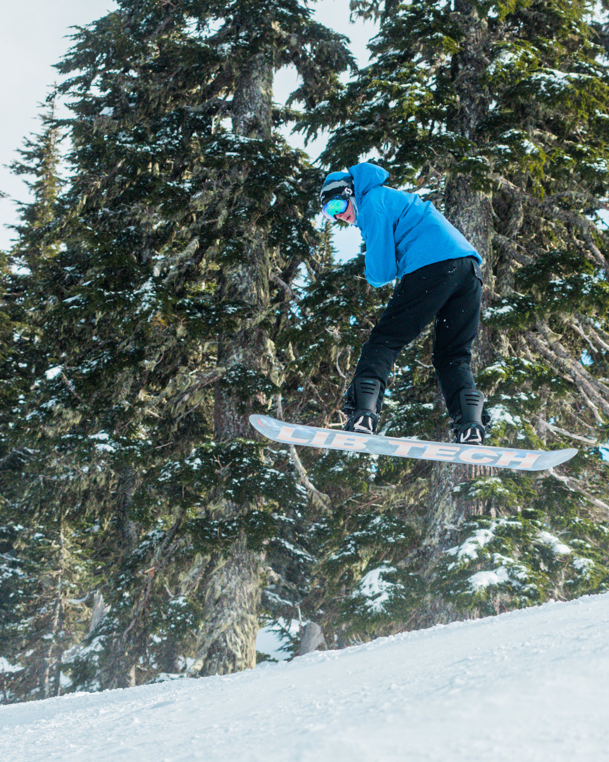 A snowboarder takes air inside the White Pass Ski Area on Sunday.