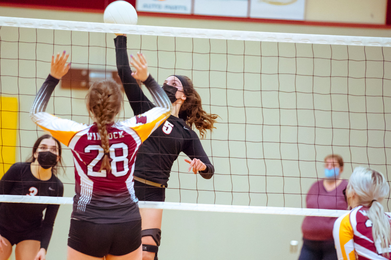 Toledo's Kate Demery (5) hits the ball during a game against the Cardinals played Monday night in Winlock.