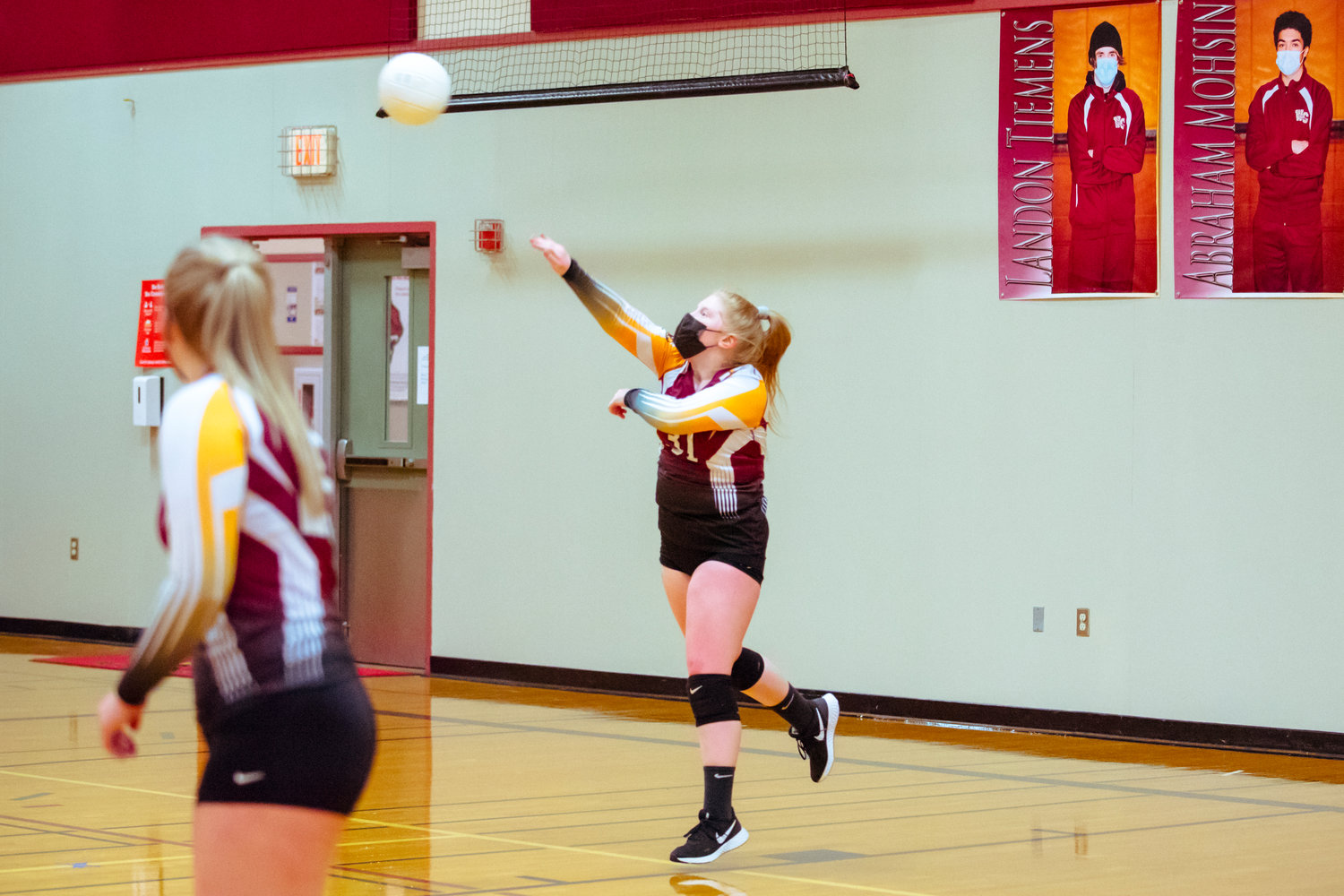 Winlock's Maddy Rohman (31) serves the ball during a game against Toledo played Monday night in Winlock.