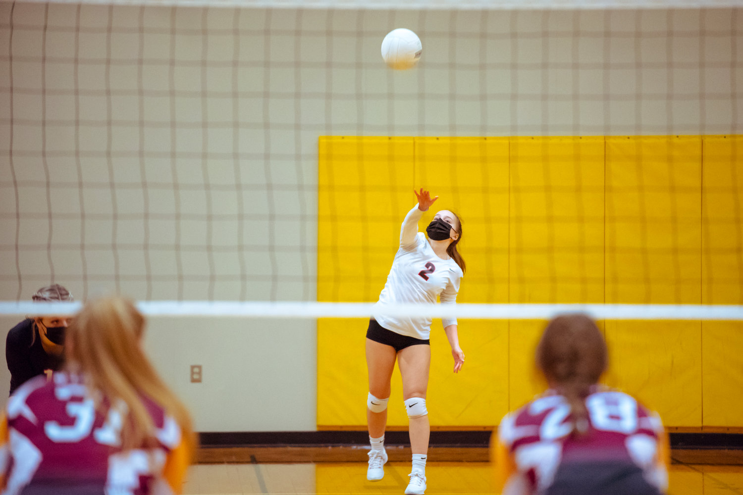 Toledo's Gracie Madill (2) serves the ball during a game against the Cardinals played Monday night in Winlock.