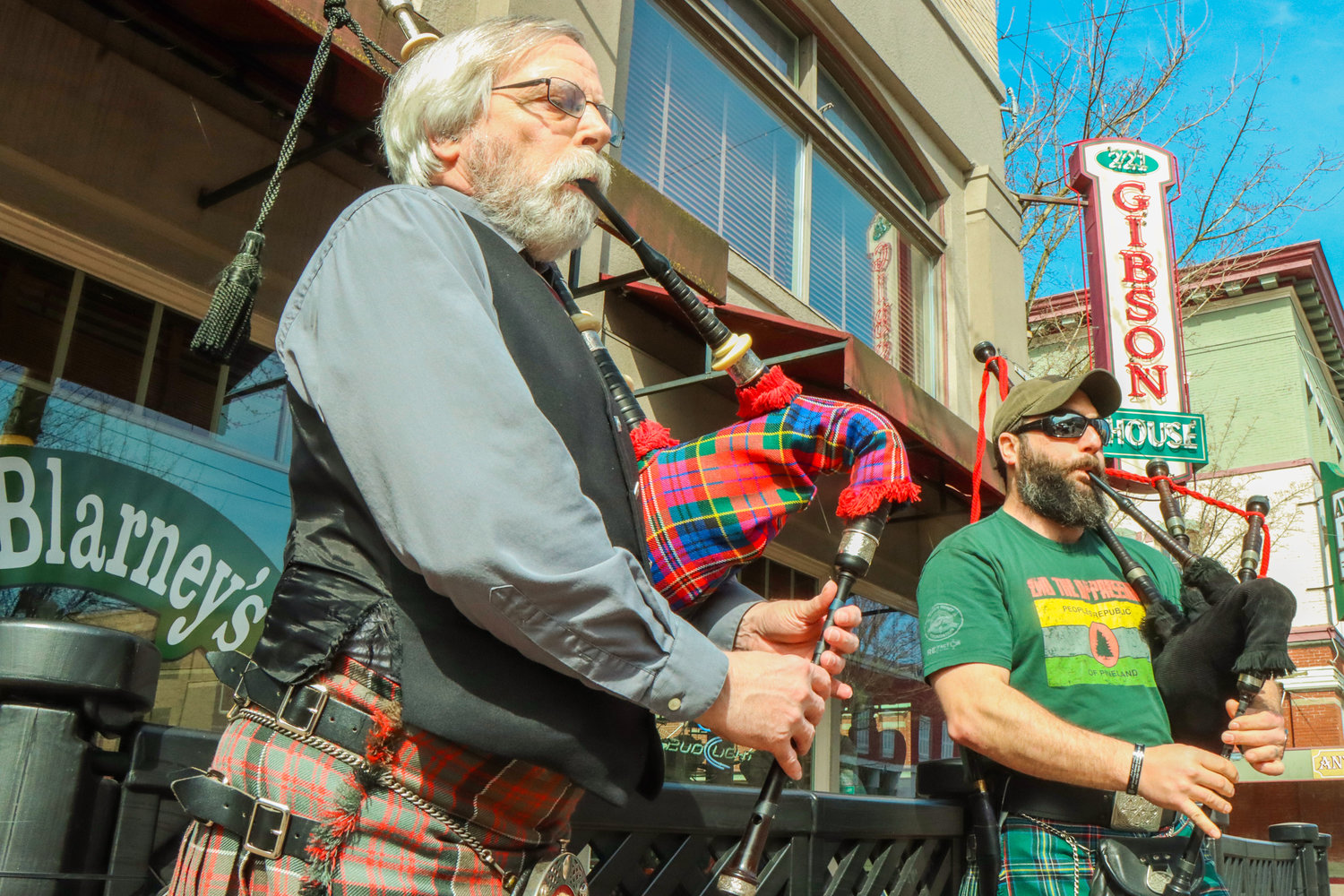 Colin Gemmell and Aaron Amick play bagpipes outside of O'Blarney's Irish Pub on St. Patrick's Day in Centralia.