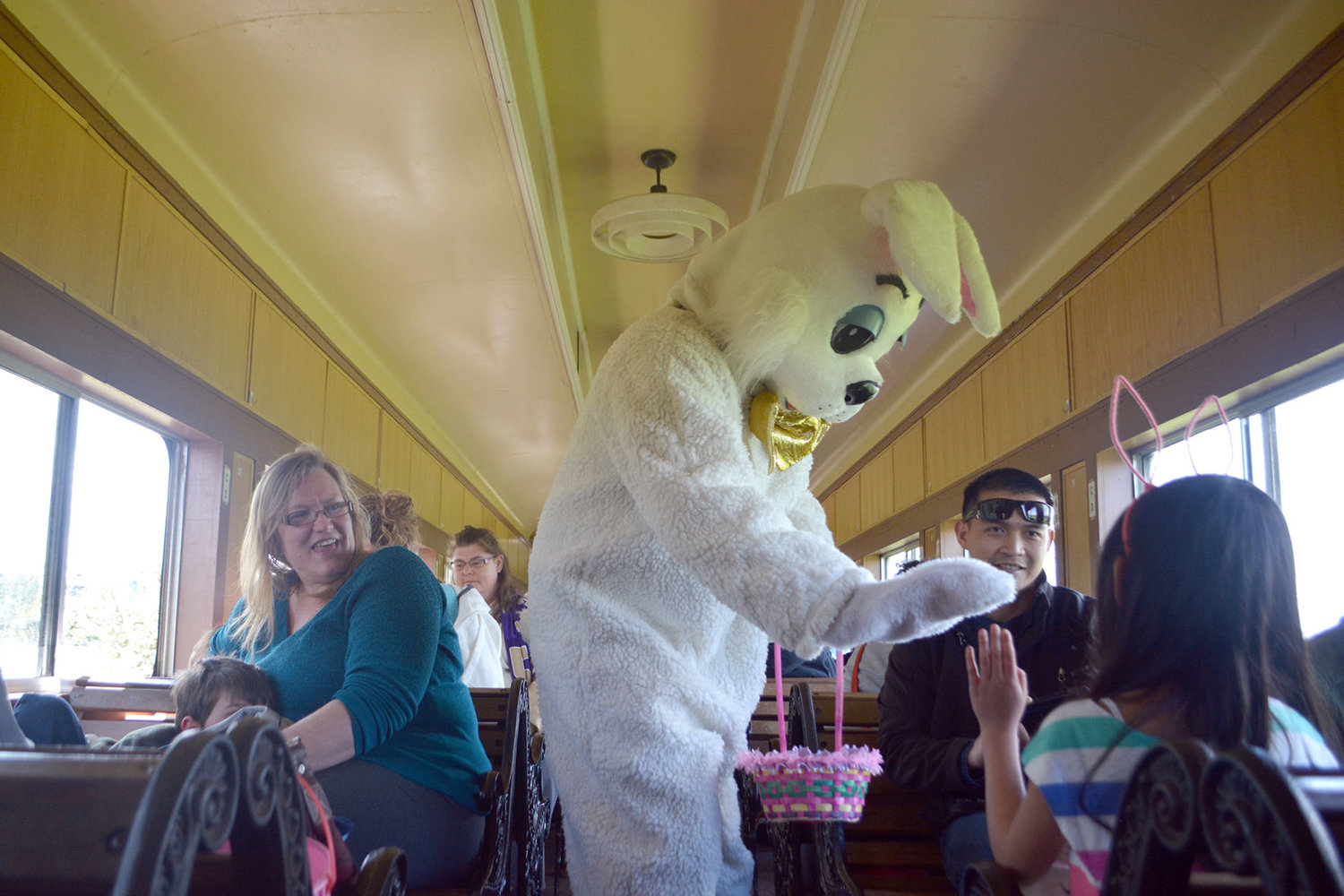 2017 FILE PHOTO — The Easter Bunny gives a high five aboard a steam train at the Chehalis-Centralia Railroad Museum.