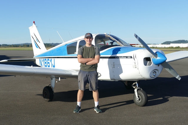 EAA Roy Aviation Scholarship recipient Tim Bowes stands in front of an airplane after taking his first solo flight on his 16th birthday in September 2020.