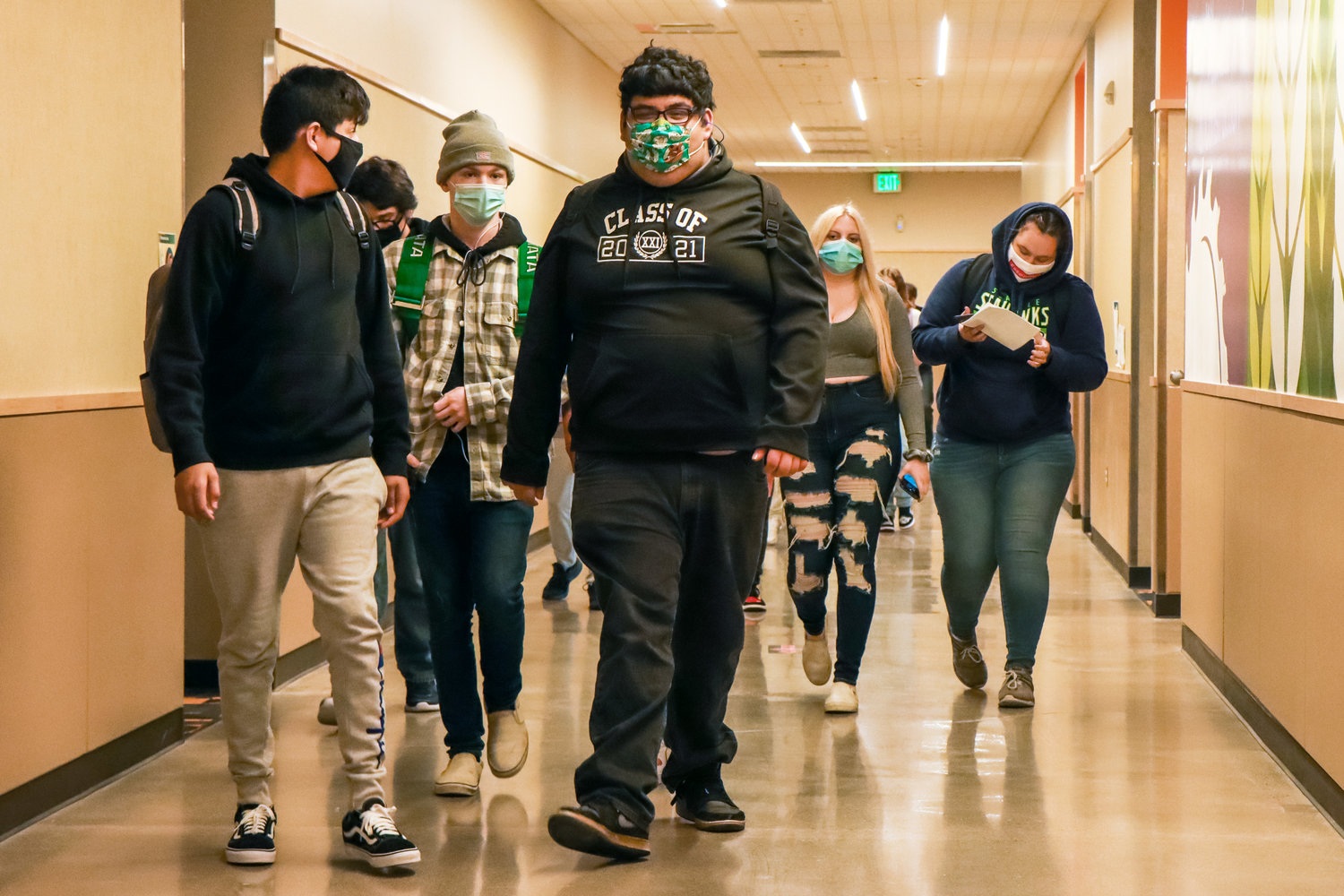 Students sport masks as they walk to their classes during their first week back in school Friday morning in Centralia High School.