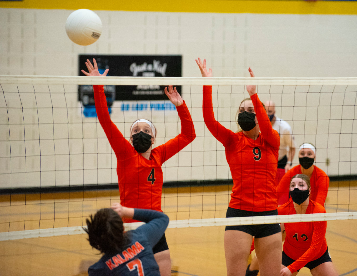 Napavine's Grace Gall (4) and Keira O'Neill (9) go for a block against Kalama on Saturday.