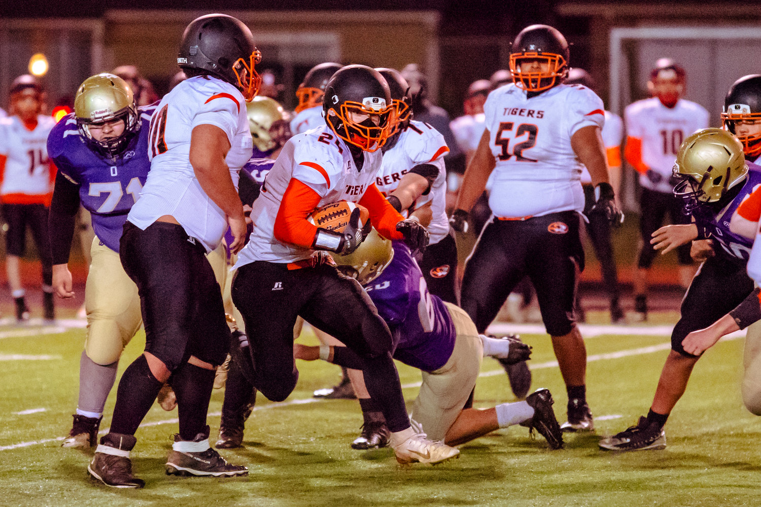 Napavine's Tanner Low (24) runs with the football during a game against Onalaska Saturday night at Tiger Stadium.