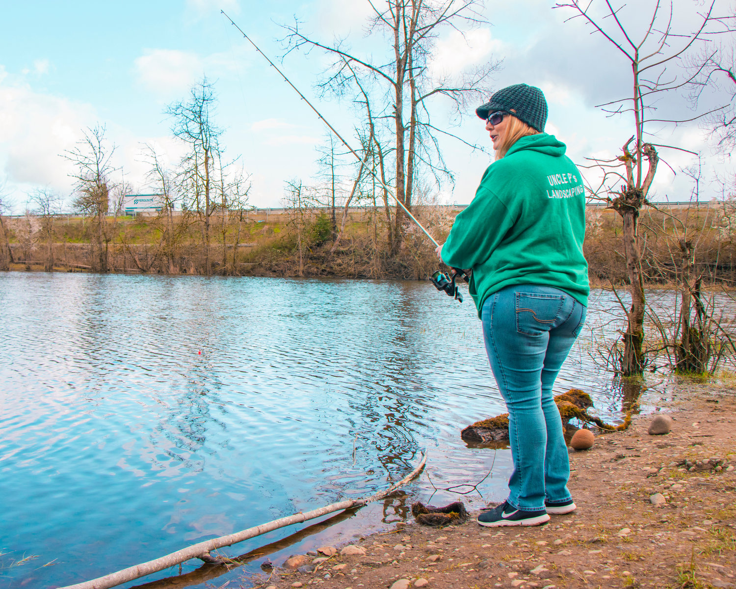 Gina Brown-Adametz celebrates her 51st birthday fishing along the bank of the Borst Park pond Monday morning in Centralia.