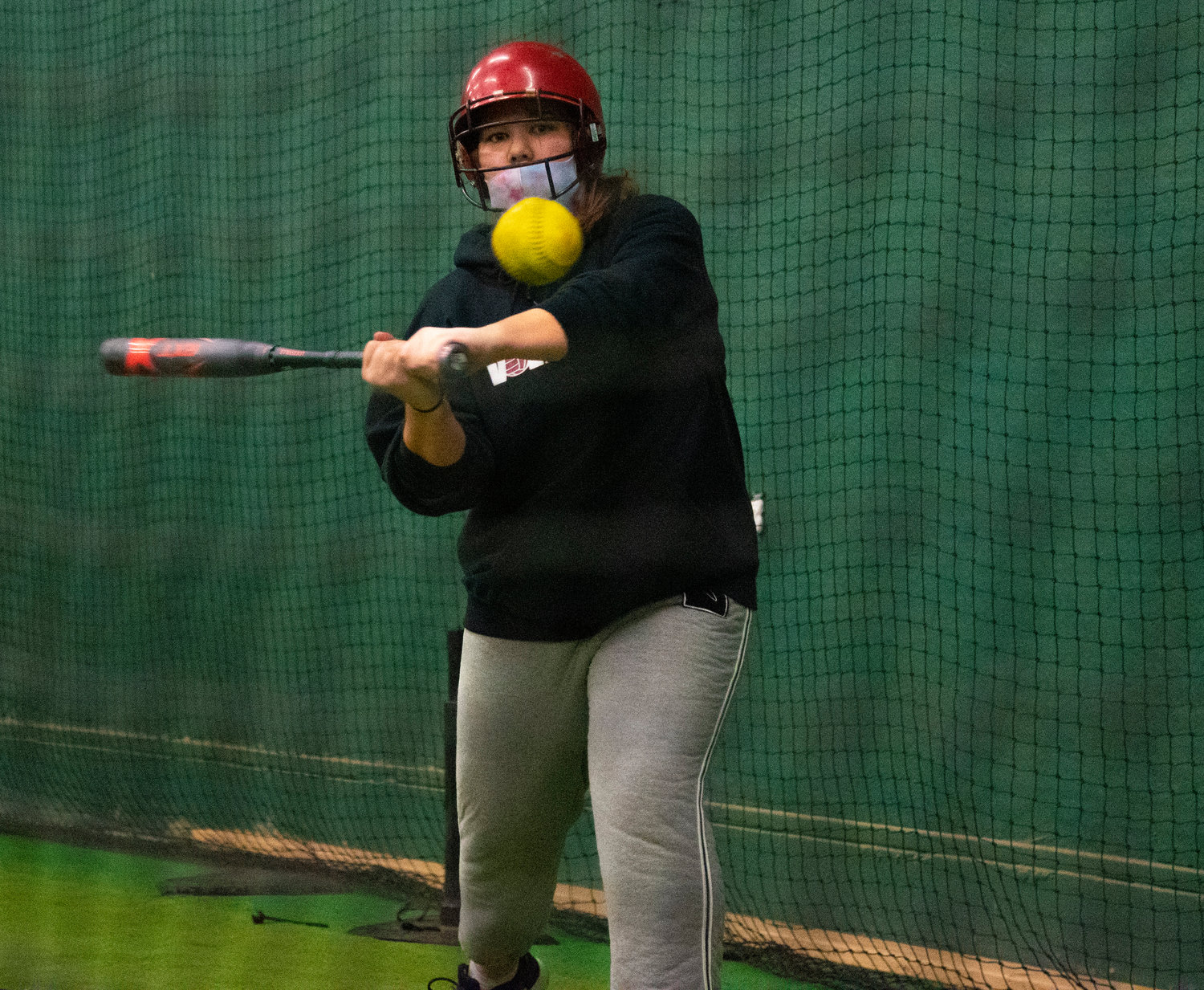 Winlock's Josalynn Shepardson takes a cut during batting practice on March 19.