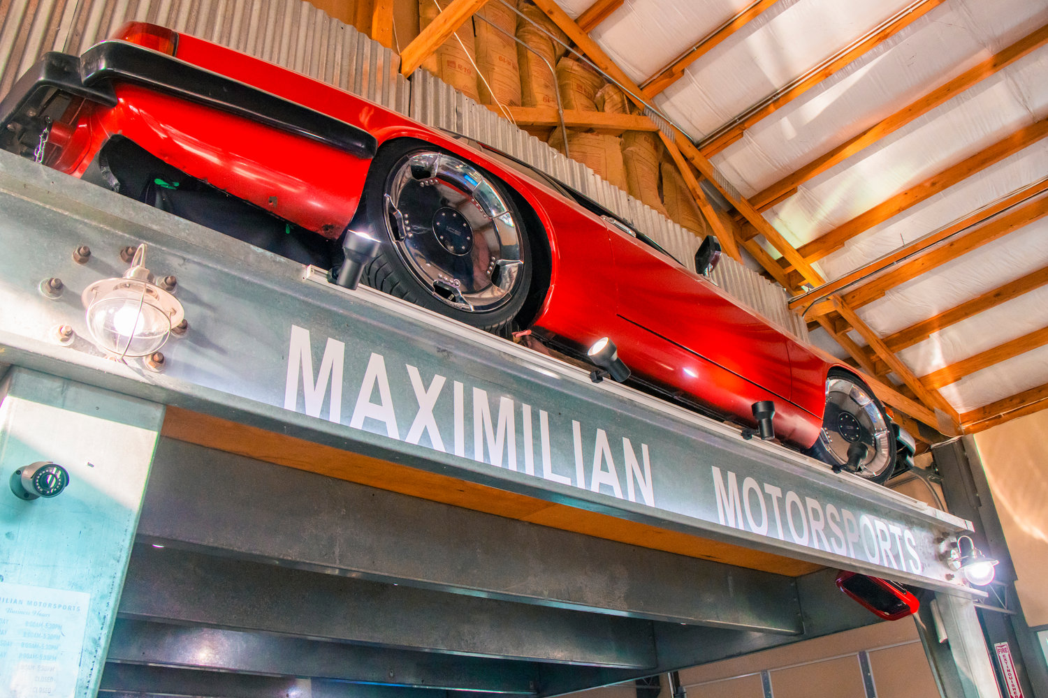 Half a car is displayed on a wall inside Maximilian Motorsports in Chehalis on Friday.