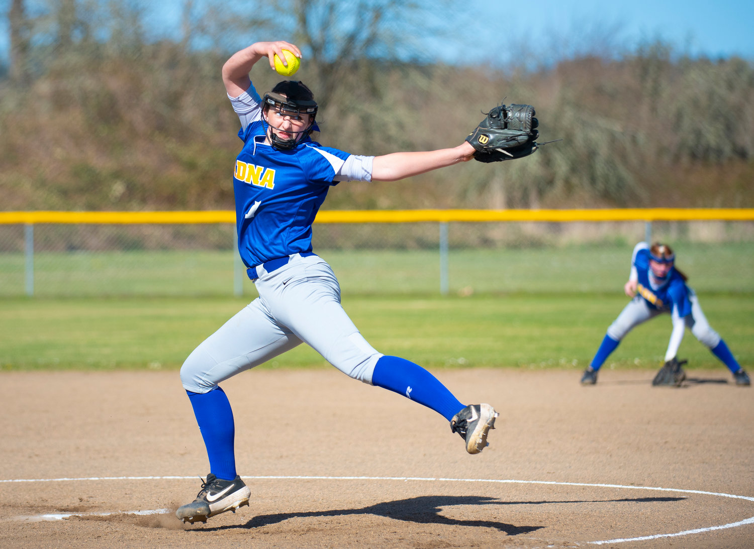 Adna ace Haley Rainey winds up to deliver a pitch to a Toledo batter on Monday.