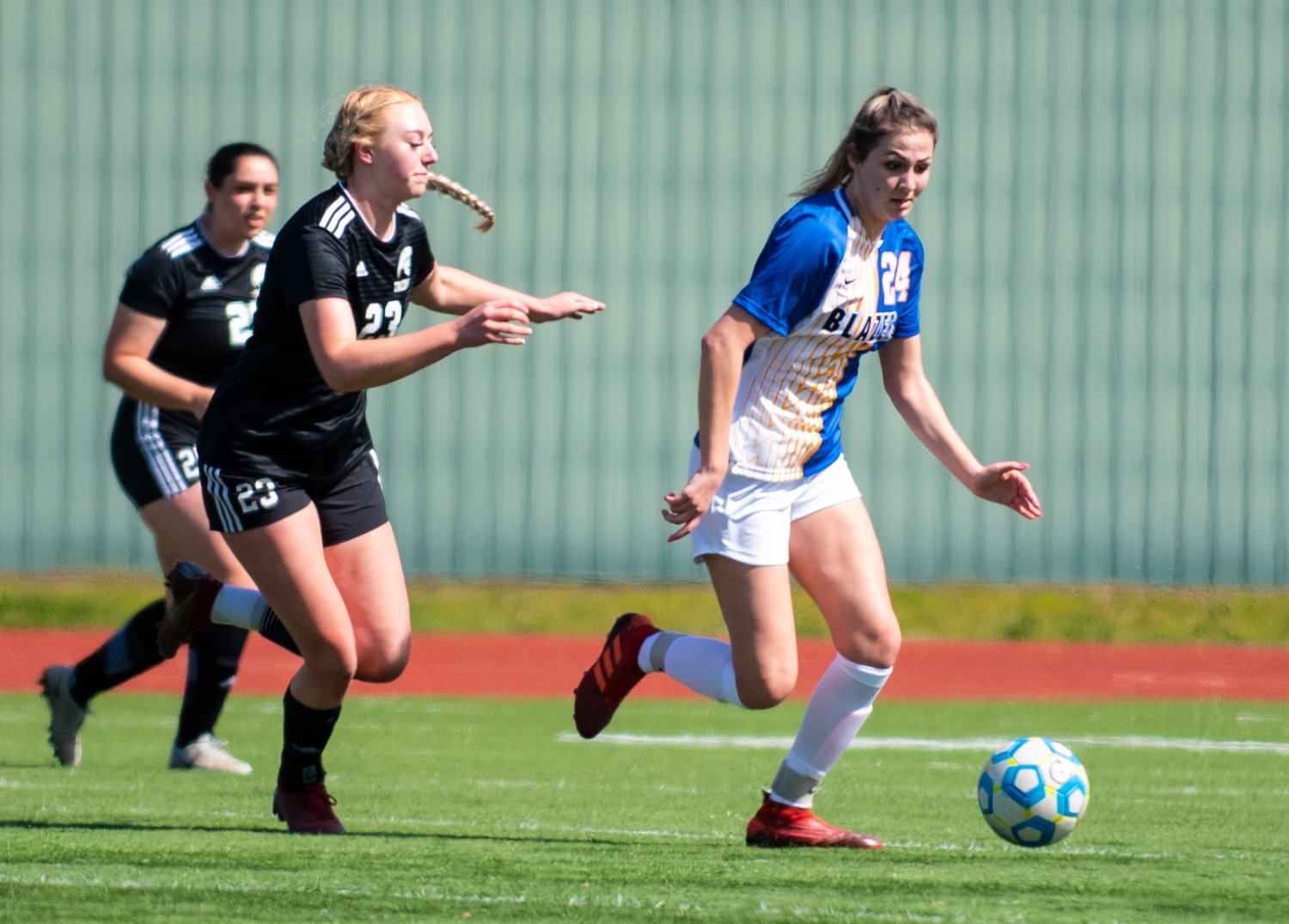 Centralia College freshman Emma Browning (24) plays keep away from Tacoma defenders on Tuesday at Tiger Stadium.