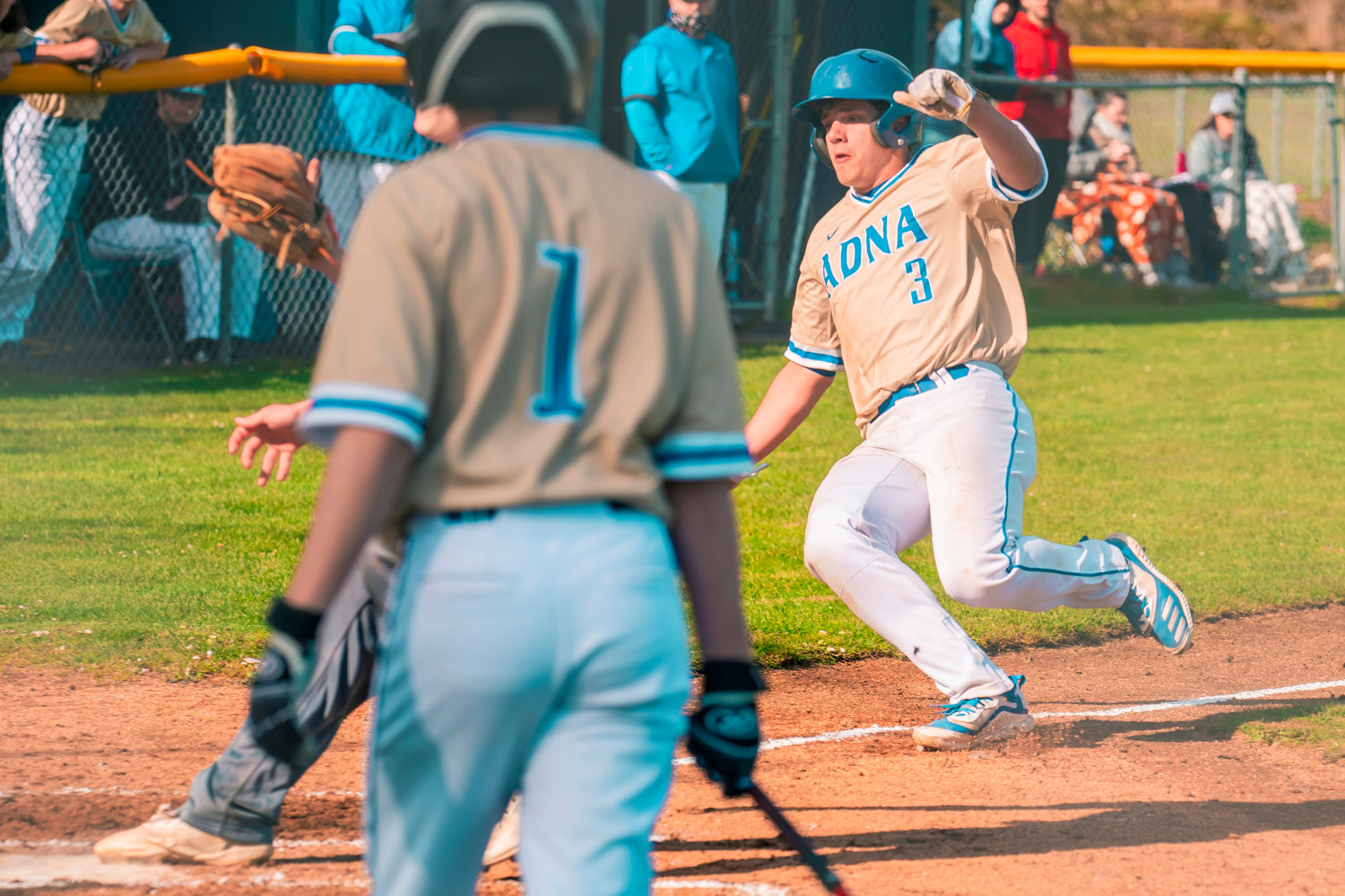 Adna’s Tyler Minkoff (3) prepares to slide into home plate Thursday during a game.
