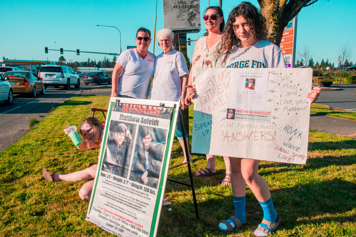 From left, Cheyenne and Sarah Anfeldt, Shirley Tax, Icy Counts and Elena Kaye hold signs to bring awareness for the missing Matthew Anfeldt during a honk-and-wave event in Grand Mound on Saturday. Attendees gathered at the park-and-ride on Southwest Tenino Grand Mound Road and held signs and fliers with information on three unsolved missing or murdered victims: Anfeldt, Logan Schiendelman and Karen Bodine. Anfeldt was last seen at the Speedway Grocery on Old Highway 99 in Grand Mound just before 5:30 p.m. on Feb. 28, 2019. Shiendelman was last seen by his grandmother on May 19, 2016, at their home in Tumwater. Later that same day, his car, a black 1996 Chrysler Sebring convertible, was towed from the shoulder of southbound Interstate 5 near milepost 92. Bodine was found dead at the entrance to a gravel pit off of Little Rock Road Southwest in Rochester on Jan. 22, 2007.