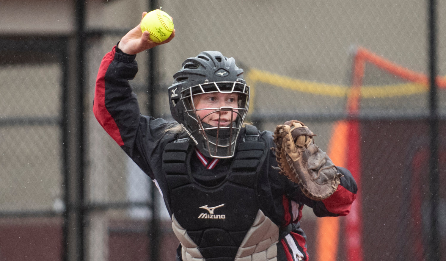 Mossyrock catcher Trista Rockwood throws a runner out at first on Saturday in Montesano.