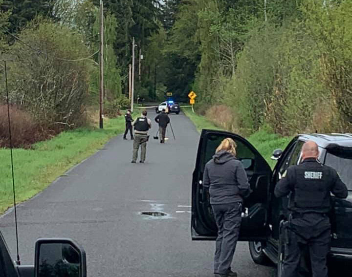 The Thurston County Sheriff's Office responds to the discovery of a body on 12th Avenue Northeast Sunday near Olympia.